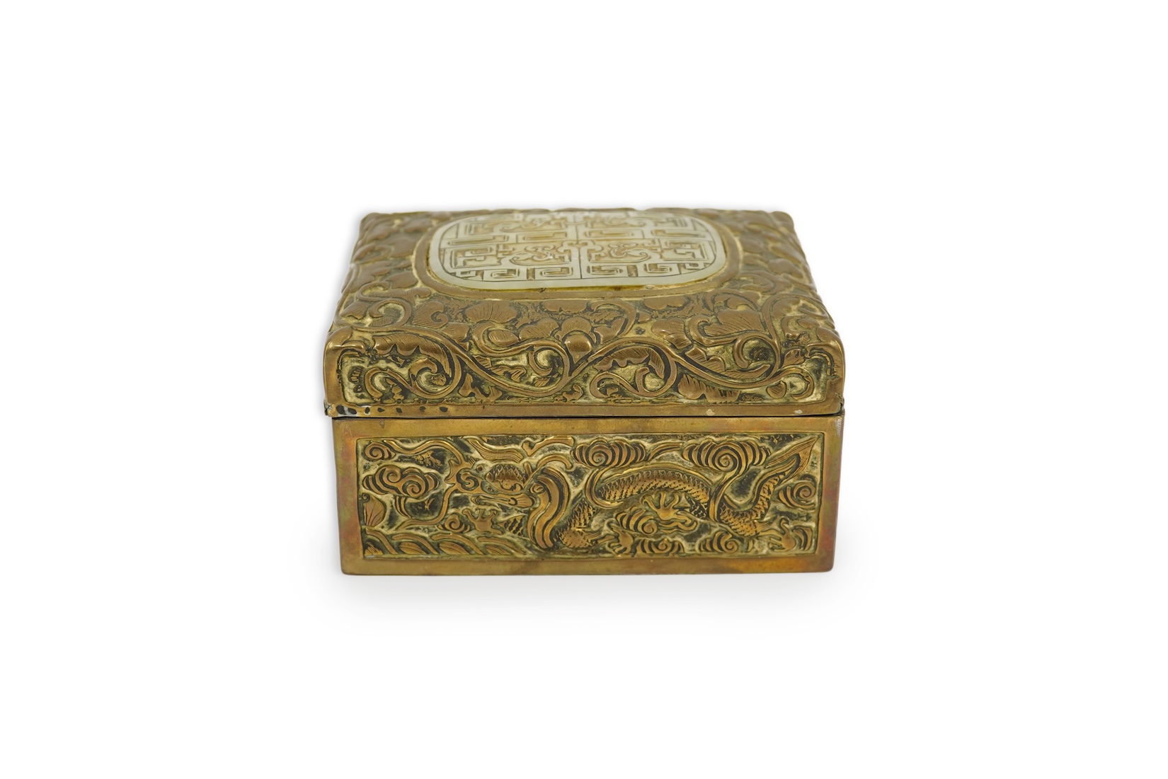 A Chinese brass 'dragon' box, inset with a 17th/18th century jade plaque